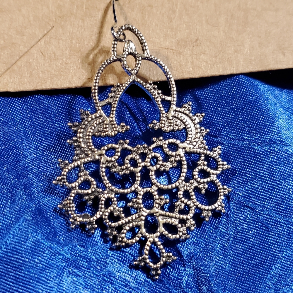 Intricate pair of dangling silver earrings